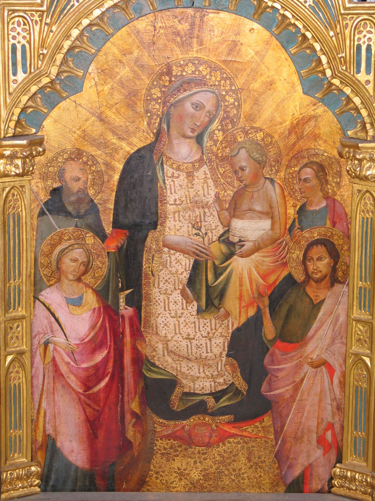 Detail of work of art depicting Virgin Mary holding infant Jesus, surrounded by saints on gold background.